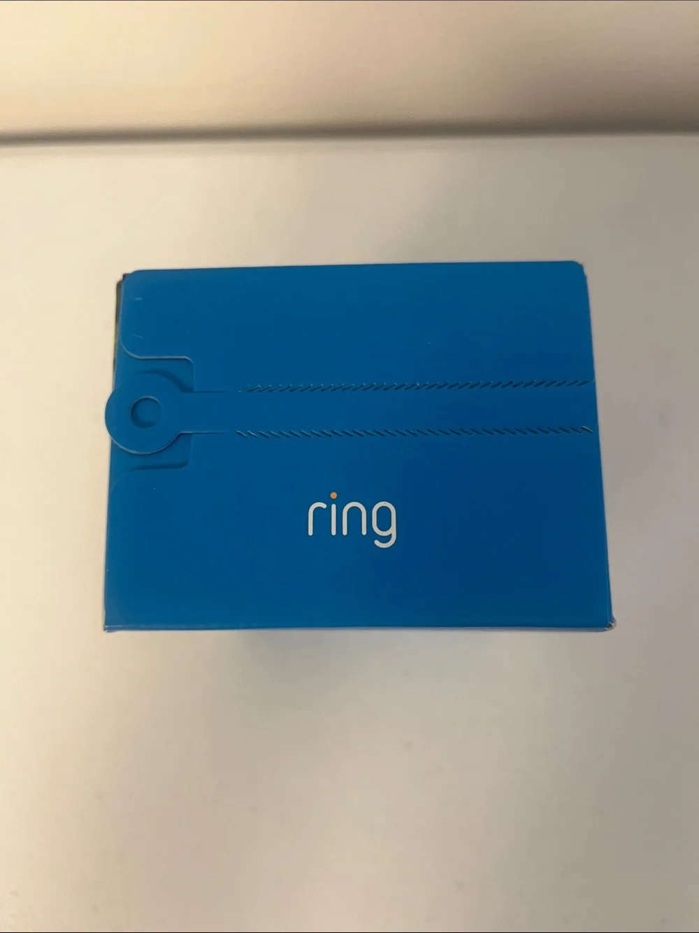 Ring Outdoor Cam Plus in black and blue packaging